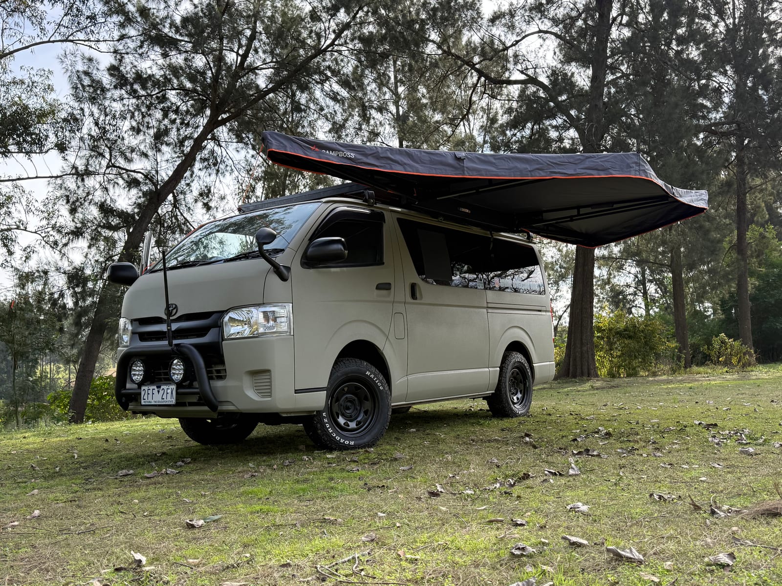 Khaki 4&times;4 Hiace &mdash; Awning out, parked up in the bush