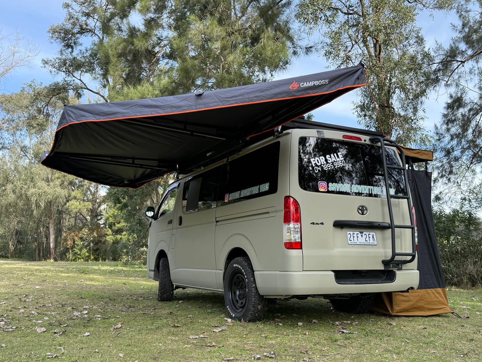 Khaki 4&times;4 Hiace &mdash; Rear quarter with the awning extended