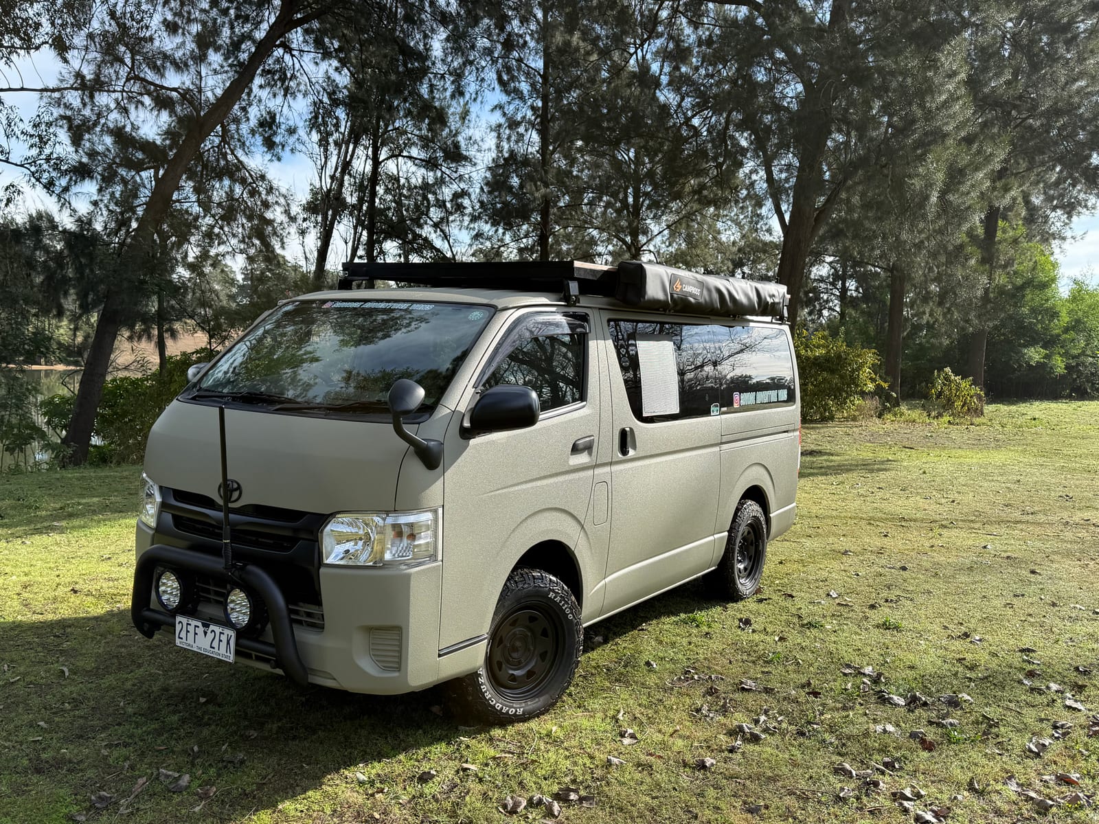 Khaki 4&times;4 Hiace &mdash; Nose on, in the trees