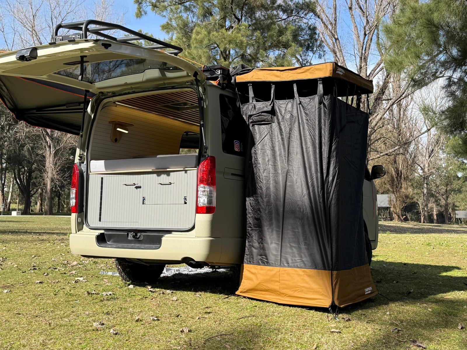 Khaki 4×4 Hiace — Ensuite tent off the rear