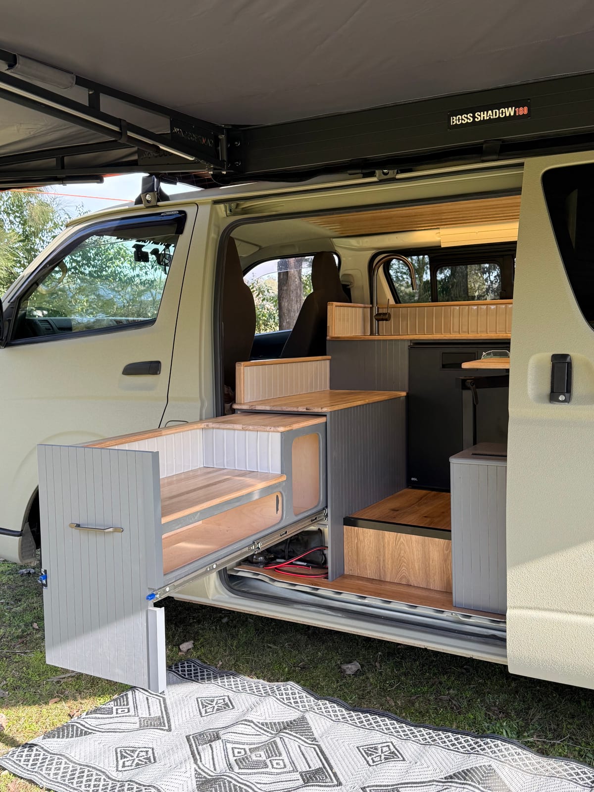 Khaki 4×4 Hiace — Cabinetry through the side door