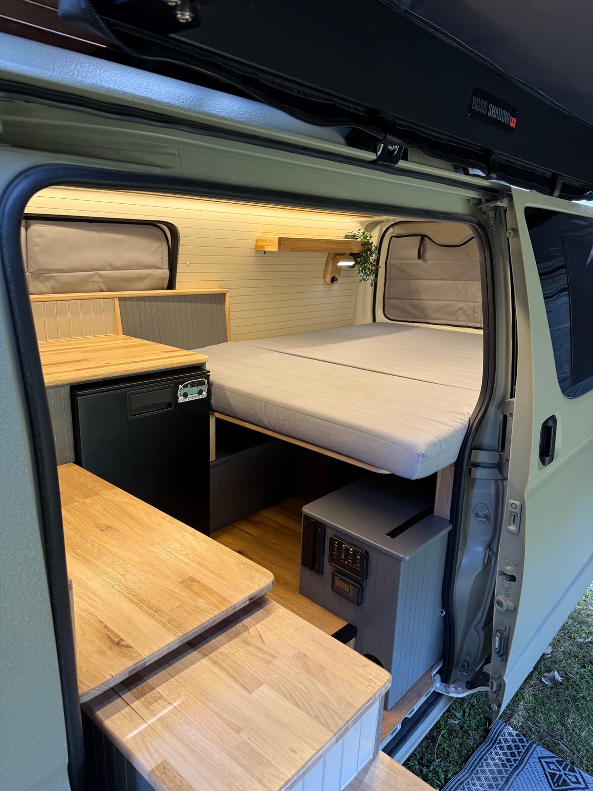 Khaki 4×4 Hiace — Bed over the storage bank