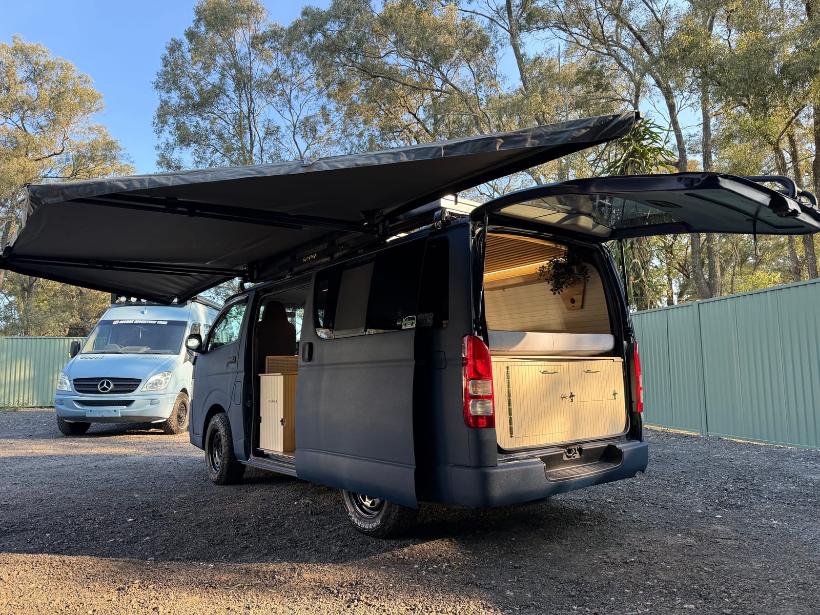 Navy 4&times;4 Hiace &mdash; Awning out, side doors open