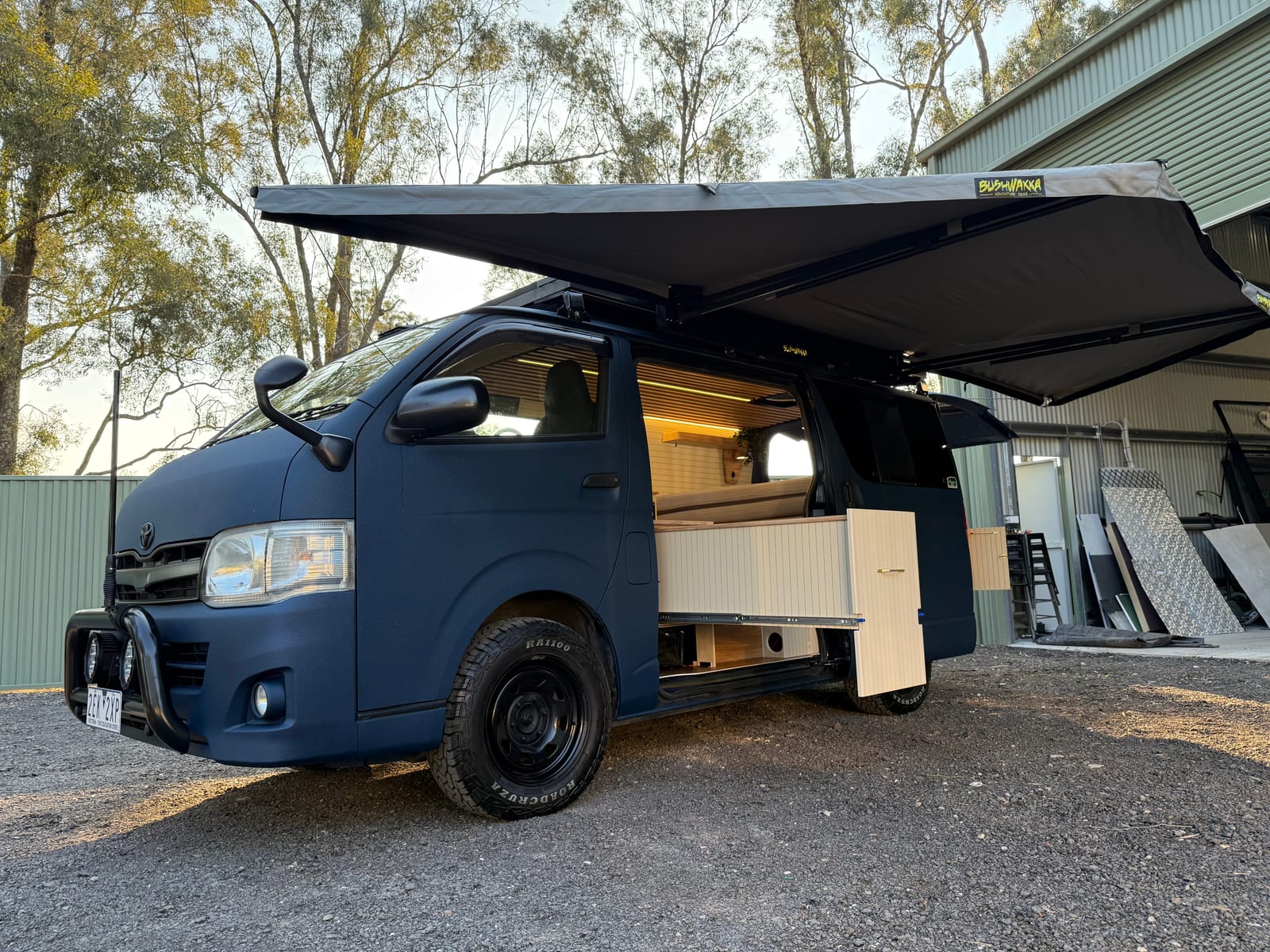 Navy 4&times;4 Hiace &mdash; Nose on under the awning