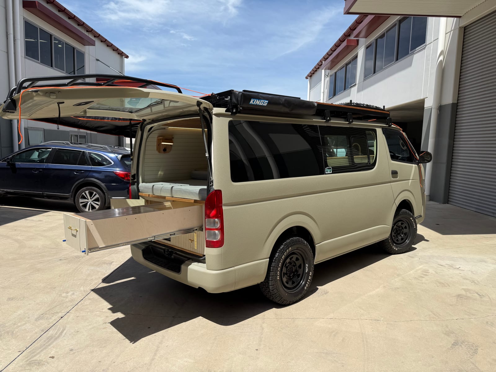 Sand Hiace &mdash; Rear quarter, doors shut