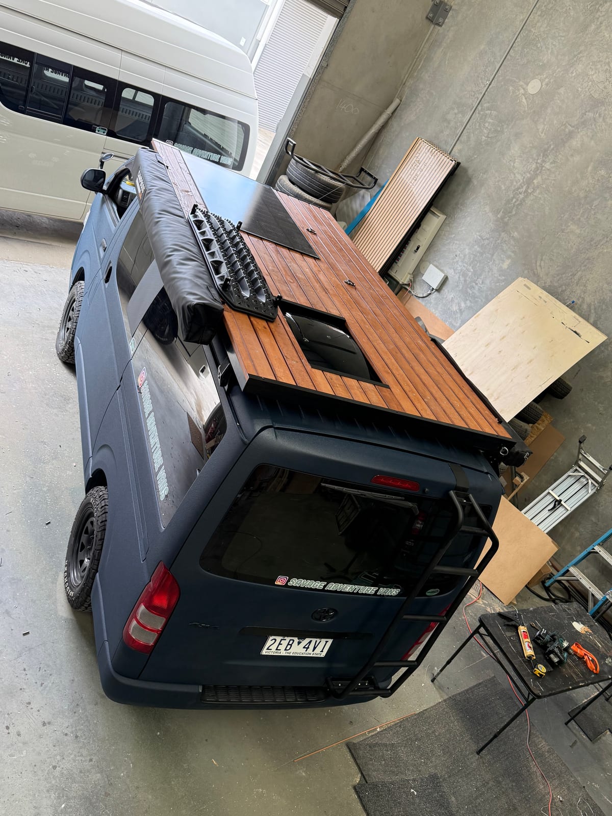 Slate Blue Hiace — Roof rack timber being fitted